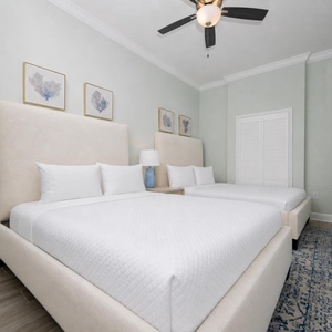 Relax on one of the cozy queen beds in this guest suite and enjoy a peaceful slumber