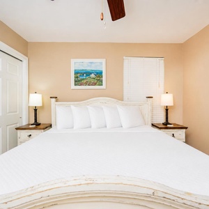 Crisp white sheets invite you to stretch out in the king guest suite after a day on the gulf