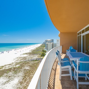 Step onto your balcony and hear distant laughter as you watch beachgoers dot the white sand coastline