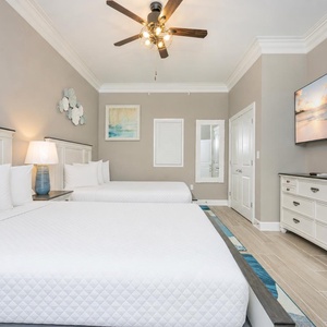 Unwind after a beach day in this guest room with two queen beds and stream your favorite shows