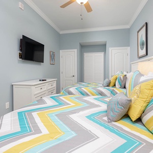 Unwind in this queen guest suite and stream your favorite shows or enjoy a good movie after a beach day