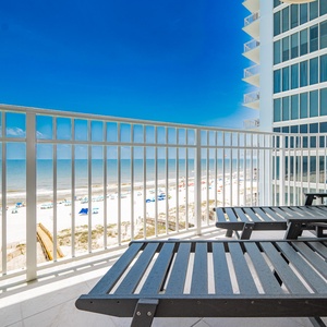 Lounge on the balcony enjoying views of the beach and the inviting coastline