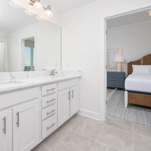 Freshen up in this guest bath in the relaxing shower or soothing tub before an exciting beach day