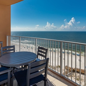 Imagine yourself watching sunlight glitter on the gulf from the balcony table as waves lap the shore