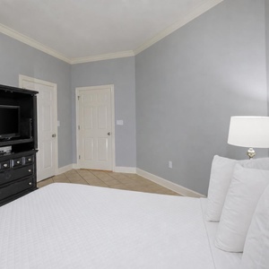 Relax on the cozy queen bed in this guest suite and stream your favorite shows after a fun vacation day