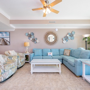 Gather in this welcoming living space and enjoy stunning beach views from the balcony