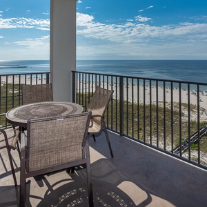 Balcony seating offers a serene view of the beach and gulf, perfect for enjoying the coastal breeze and sunshine