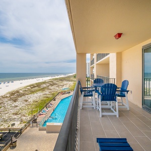 Enjoy the refreshing coastal breeze from your balcony while taking in views of the beach and vibrant blue skies