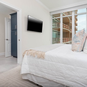 Curl into fluffy pillows, play a movie on the mounted TV, and enjoy beach views from this king guest suite
