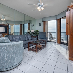 Relax in the inviting living area with comfortable sofa with queen sleeper and stunning beachfront views