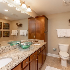 Refresh in the master bath after a day at the beach with a soothing jetted tub and relaxing walk-in shower