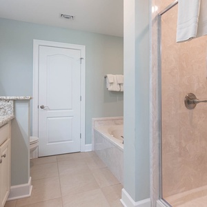 Indulge in relaxation in the master bath with a refreshing walk-in shower and soothing jetted tub
