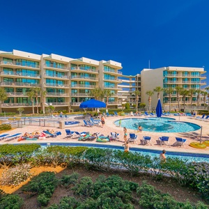 Discover the pool area with a refreshing lazy river and thrilling waterslide, just steps from the bay