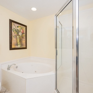 Indulge in relaxation in the master bath with a refreshing walk-in shower and soothing jetted tub