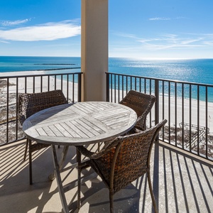 Enjoy meals or drinks on the balcony overlooking the tranquil waters and shoreline