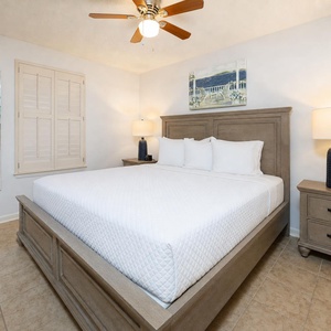 Rest in the king guest suite, enjoying cozy nights with beach decor setting a serene coastal vibe in your room