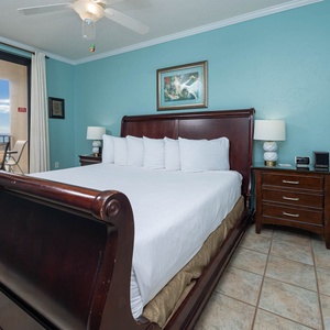 Relax in the master bedroom featuring a king bed and easy access to the balcony with beautiful beachfront views