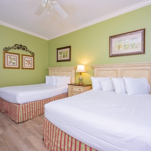 Relax in the spacious guest room with two queen beds, perfect for family comfort and restful nights together