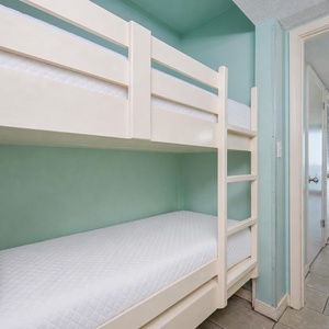 Bunk beds in the sleeping area offer a cozy spot for the kids after fun-filled days along the coast