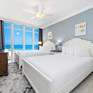 Lie back on two soft queen beds in the guest suite and watch the sun bounce across the gulf through tall windows