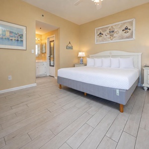 The master features a king bed, soft beige walls, and a bright en-suite bathroom for a relaxing getaway