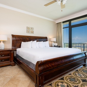 Retreat to the king master suite with cozy bedding and drift off to the sound of the waves from the balcony
