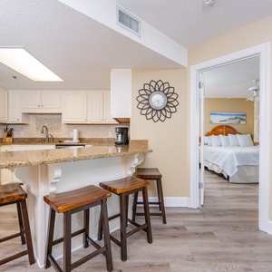 Gather in the kitchen to share laughs across the breakfast bar, feeling the inviting coastal vibe of your getaway