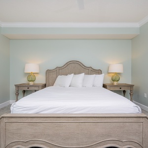 Rest in the plush queen bed and recharge as soft lighting creates a peaceful atmosphere in this guest suite