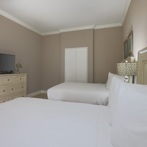 Unwind in this tranquil guest room, streaming favorite shows as you drift into restful nights in a cozy queen