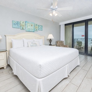 Drift into bliss in the king master suite before a restful night with beach vibes just outside your balcony door