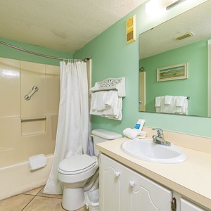 Refresh and rejuvenate in the master bath, complete with soft towels ready for your beach adventures