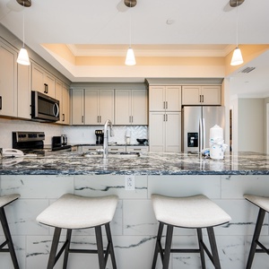 Gather around this stylish kitchen, perfect for casual meals and enjoying time with loved ones