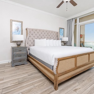 Retreat to the king master suite with cozy bedding and drift off to the sound of the waves from the balcony