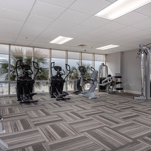 Keep up with your routine in the fitness center at Seawind with stunning views of the beach just outside the large windows