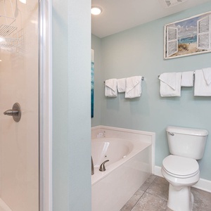 Indulge in relaxation in the master bath with a refreshing walk-in shower and soothing jetted tub