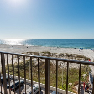 Enjoy stunning beachfront views from this inviting balcony, perfect for relaxing and soaking in the serene atmosphere