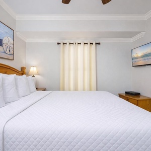 Sink into the soft, plush king bed, surrounded by serene decor, perfect for restful nights and rejuvenating sleep
