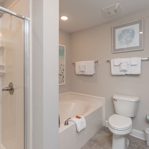 Indulge in relaxation in the master bath with a refreshing walk-in shower and soothing tub