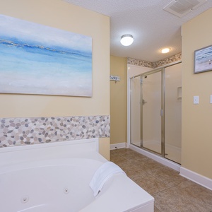 Sink into the soothing jetted tub or step into the refreshing walk-in shower in the master