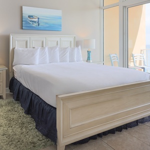Sleep soundly on the king bed, waking up to breathtaking views and gentle sounds of the coast in this master suite