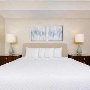 Sink into a plush king bed, surrounded by soft lighting and serene decor, for restful nights at your getaway