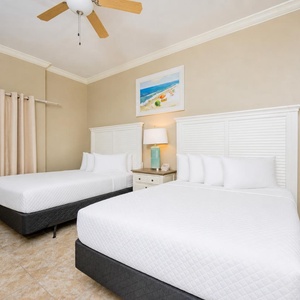 Feel rejuvenated as you drift into slumber in this queen guest suite, surrounded by calming decor for ultimate relaxation