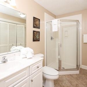 Refresh in this additional guest bath with a walk-in shower and laundry area with a washer and dryer in your rental
