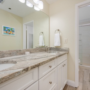 Experience a refreshing start to your day in the master bath with a walk-in shower, surrounded by calming vibes