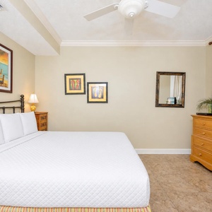 Drift into comfort on the soft queen bed, letting the serene decor enhance your restful stay