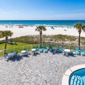 Complement your stay with a stunning beachfront view with a sparkling pool and lounge chairs for relaxing in the sun