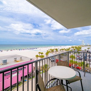 Enjoy the sun shining on your balcony while relaxing in comfortable chairs with stunning water views