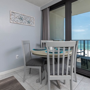 Enjoy dining at this charming table with a breathtaking beachfront view just beyond the large glass doors