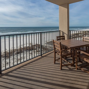 Dine al fresco at the outdoor table, enjoying refreshing breezes and views of the tranquil waters and shoreline