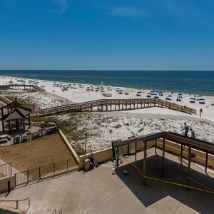 Enjoy breathtaking views of the beach and pool area from your private balcony, perfect for relaxation and fun